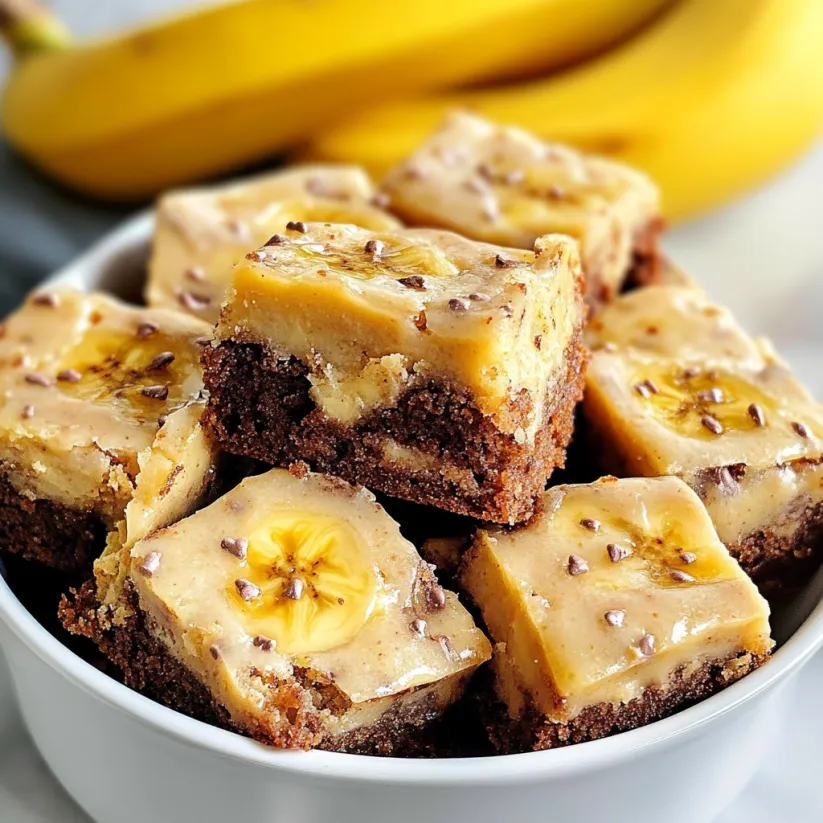 A bowl of brownies with banana slices on top.
