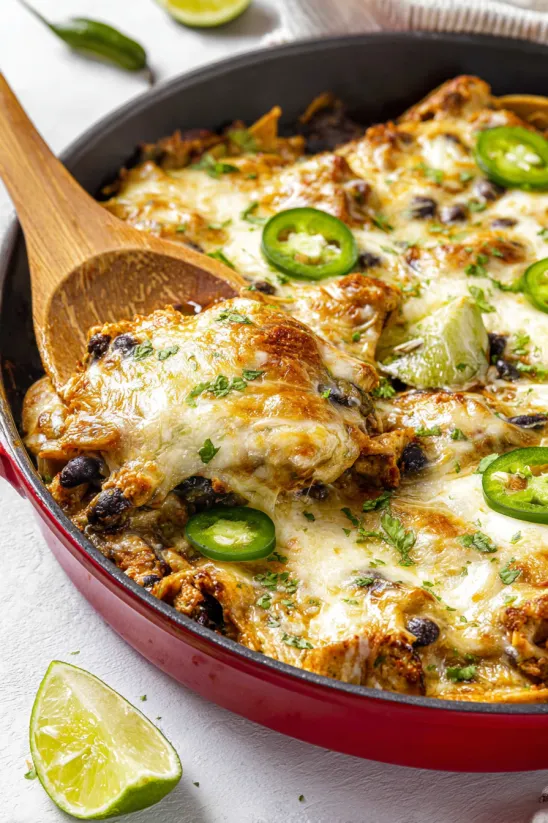 A close up of a chicken enchilada casserole.