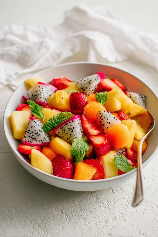 A bowl of tropical fruit salad.