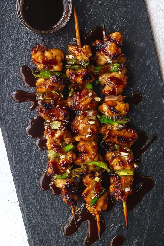 A skewer of meat with sauce.
