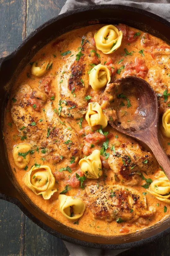 A bowl of food with a spoon in it.