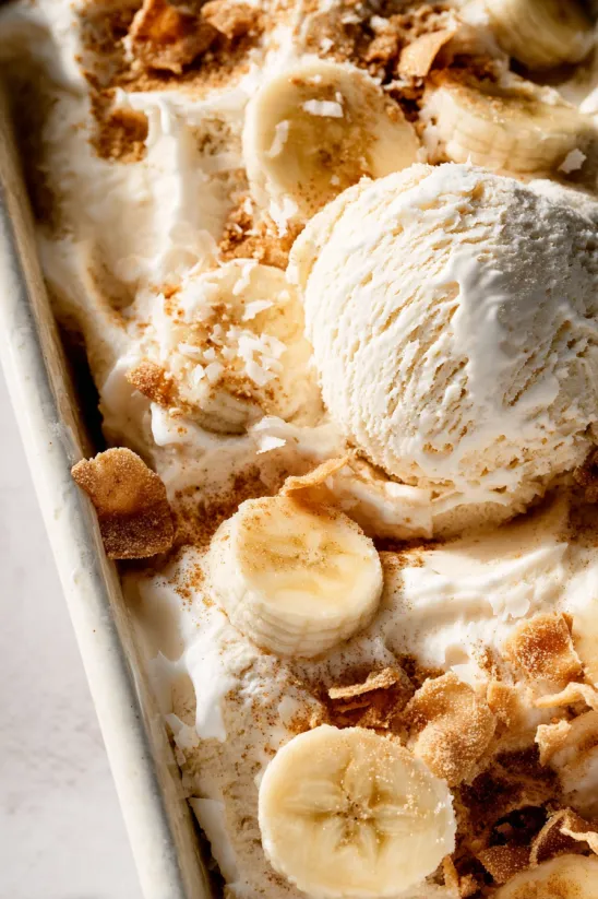 A banana split with a scoop of ice cream.