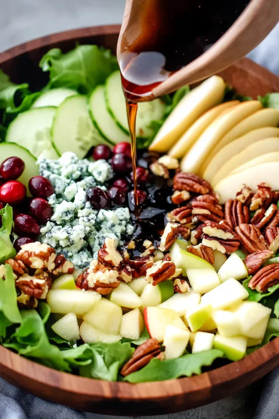 A bowl of fruit with a drizzle of caramel sauce.