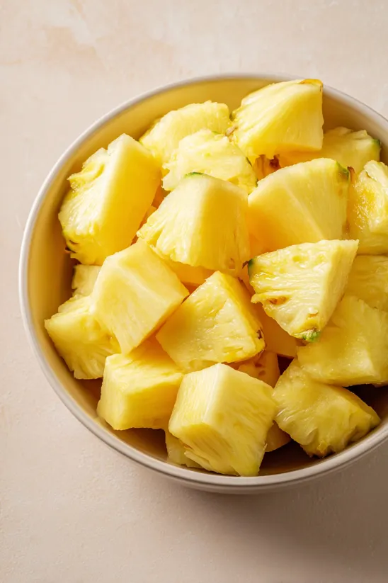 A bowl of sliced pineapple.