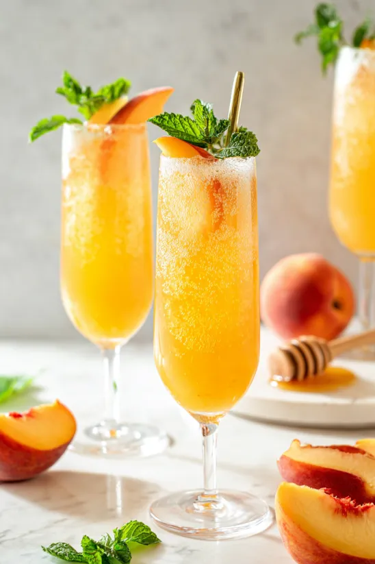 Two glasses of peach bellini.