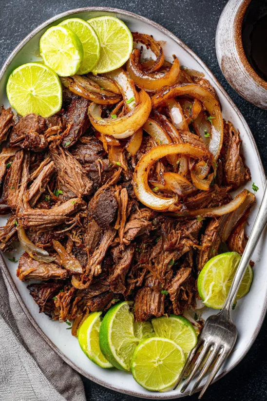 A plate of meat and onions.