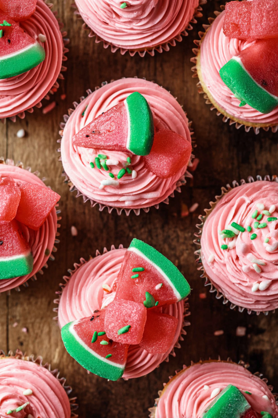 A collection of watermelon buttercream cupcakes.