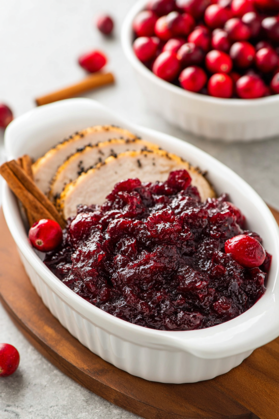 A white bowl filled with cranberry sauce.