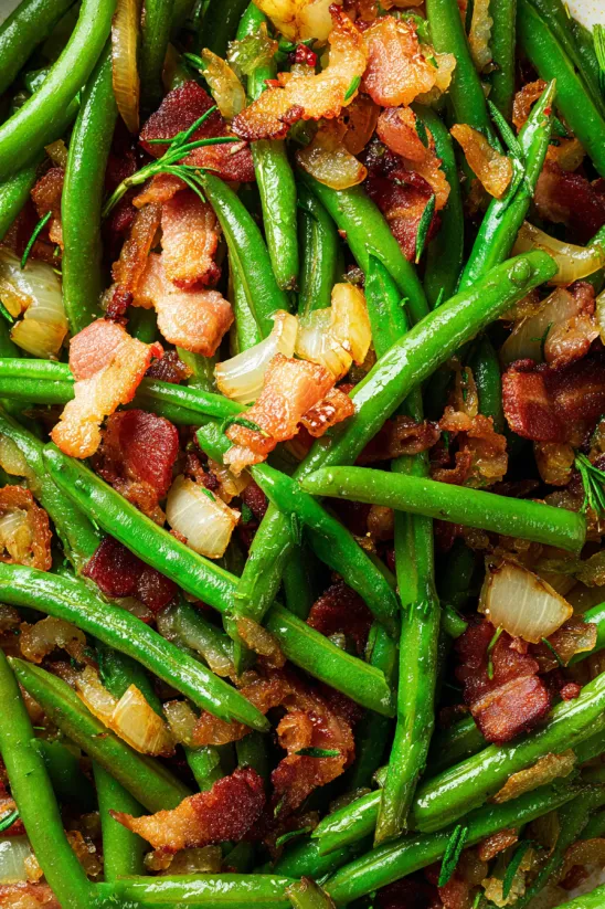Bacon and green beans on a plate.