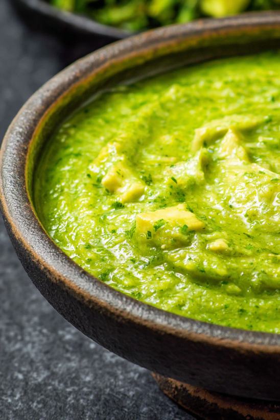 A bowl of green soup.