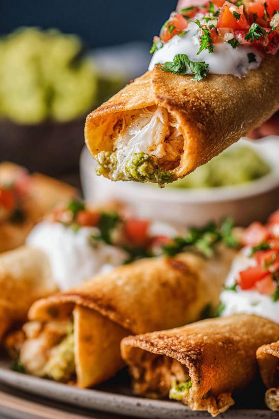 A person is eating a burrito.