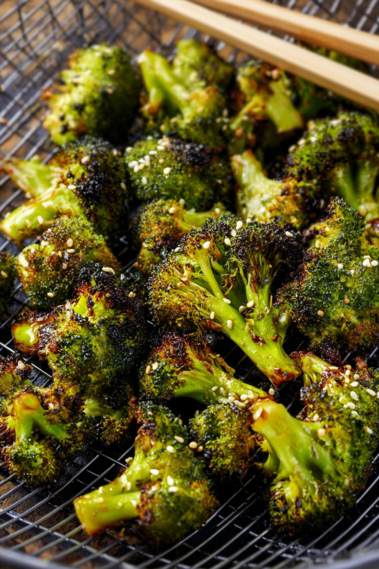 A tray of broccoli with seasoning.