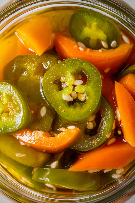 A bowl of sliced green peppers.