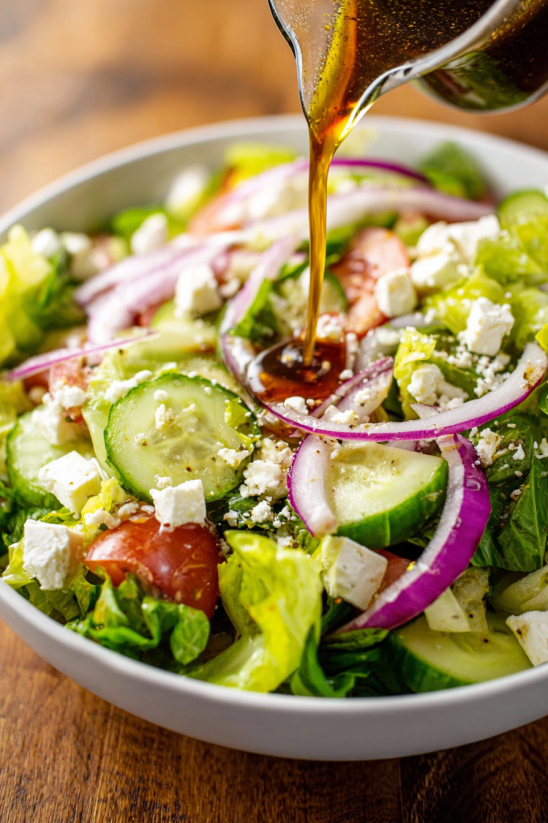 A salad with cheese and onions.