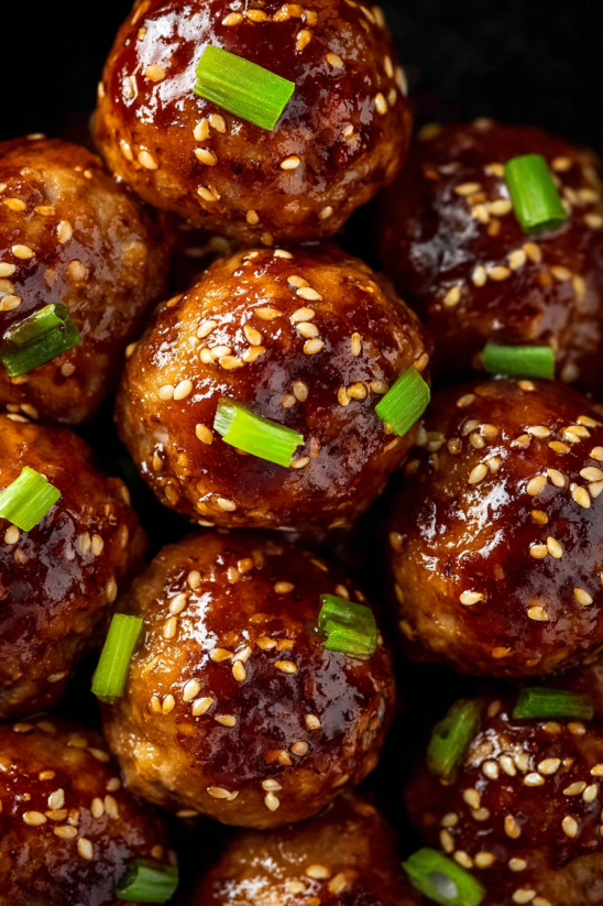 Asian chicken meatballs with a sauce.