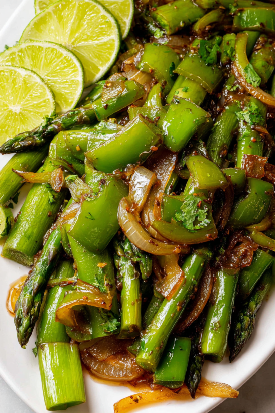 A plate of food with green beans and onions.