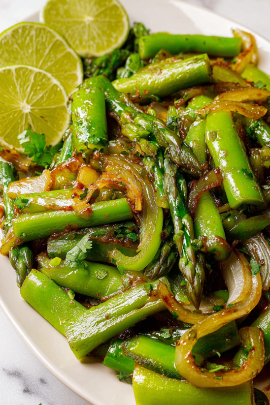 A plate of food with green beans and onions.