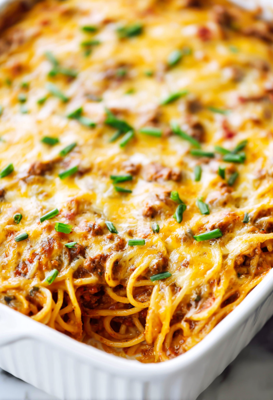 A dish of spaghetti with meat and cheese.