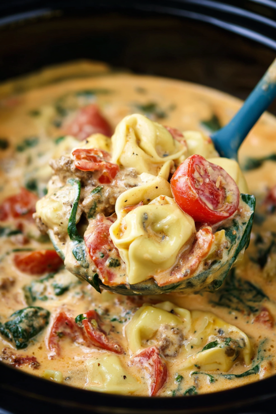 A bowl of food with a spoon in it.