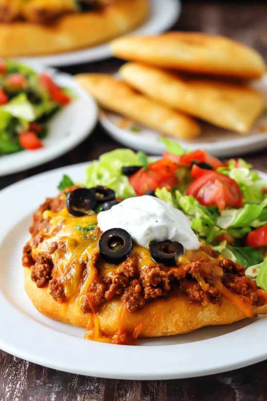 A plate of food with a burrito on it.