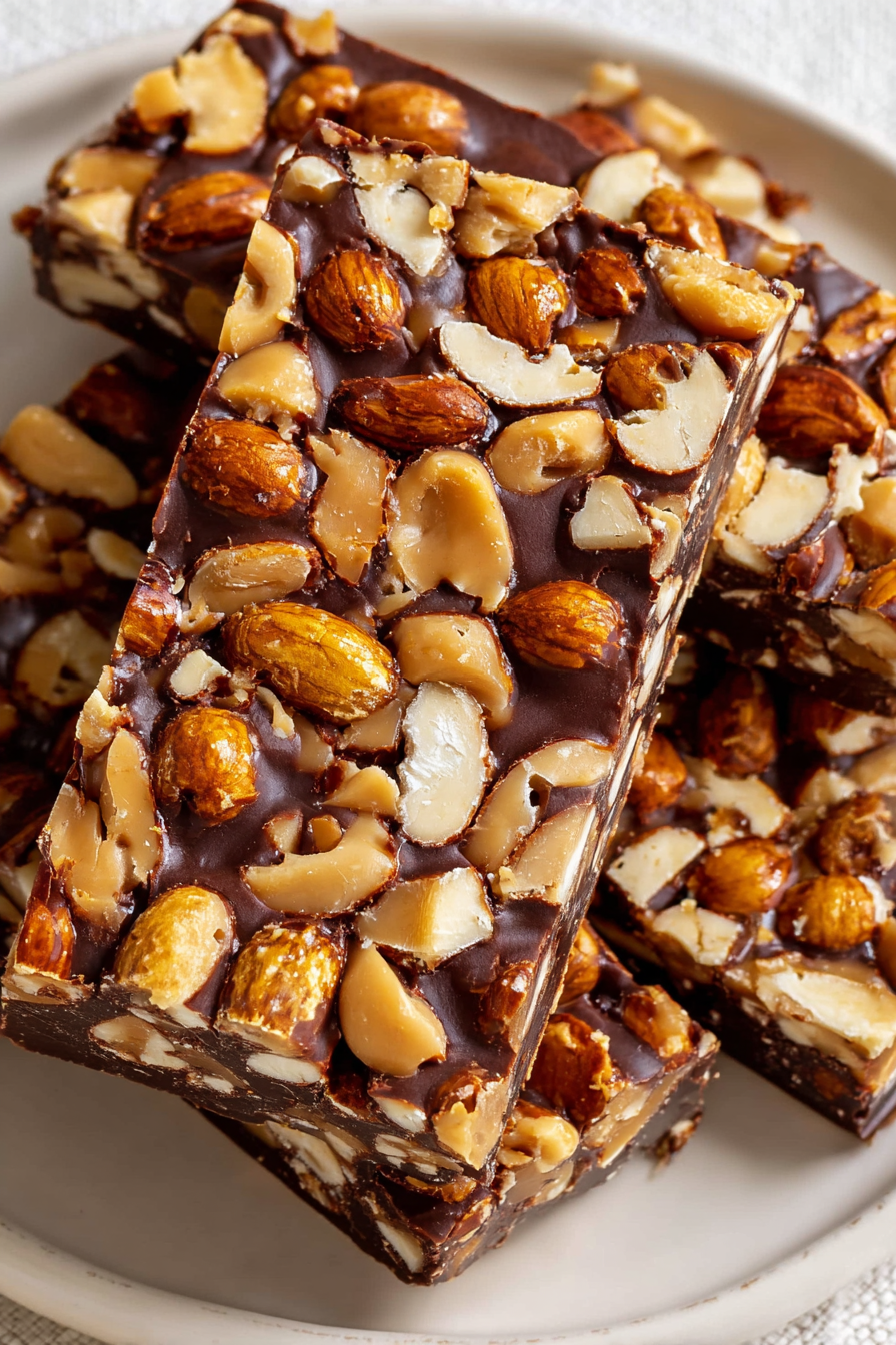 A close up of a chocolate bar with nuts.