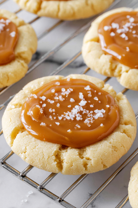 A cookie with caramel sauce on top.