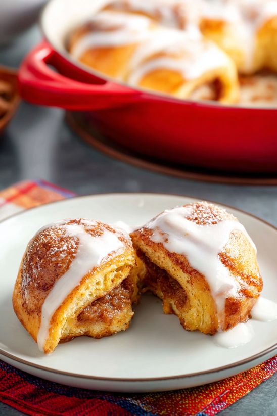 A plate with two donuts on it.