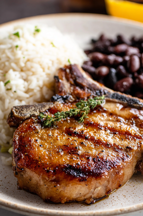 A plate of food with a chuleta frita.