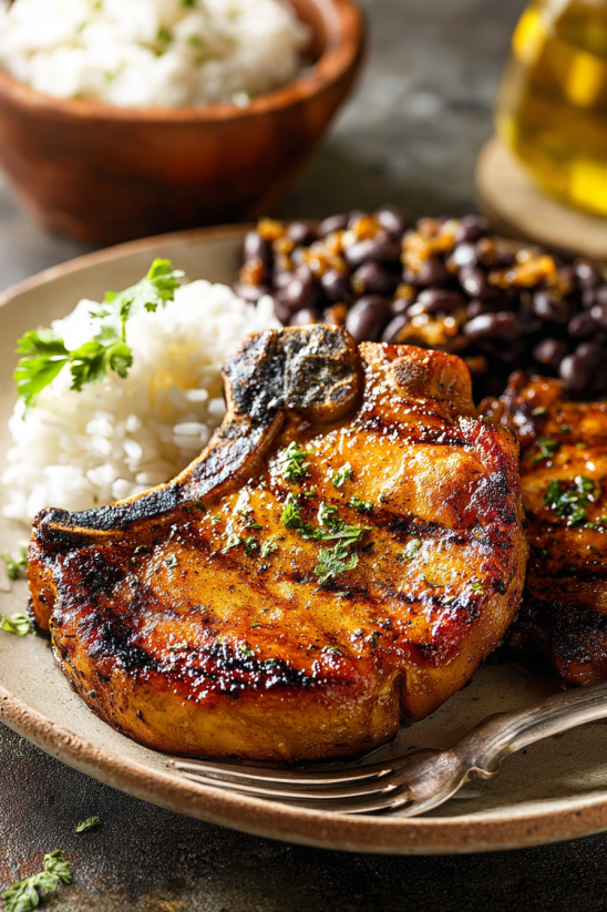 A plate of food with rice, beans, and meat.