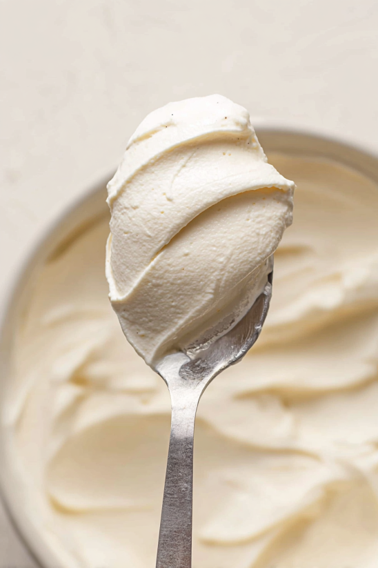 A spoonful of whipped cream cheese frosting.