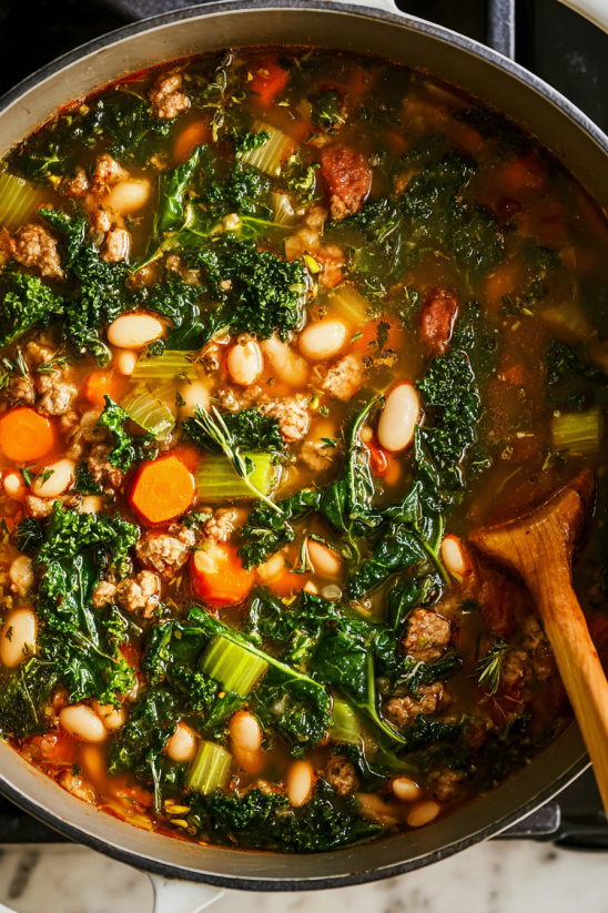 A bowl of soup with vegetables and meat.