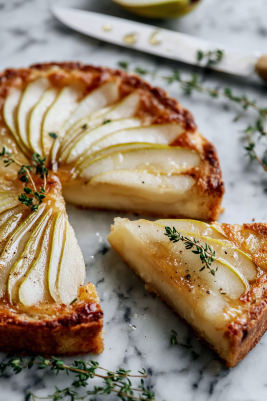 A slice of apple pie on a marble table.