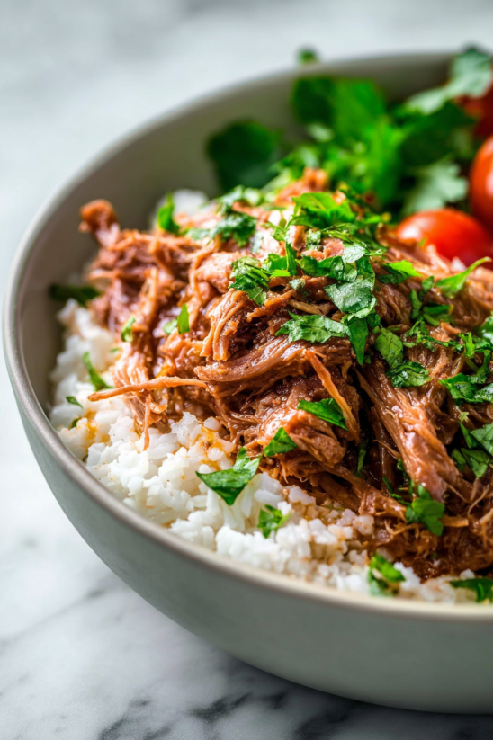 A bowl of slow cooker Cuban mojo pork.