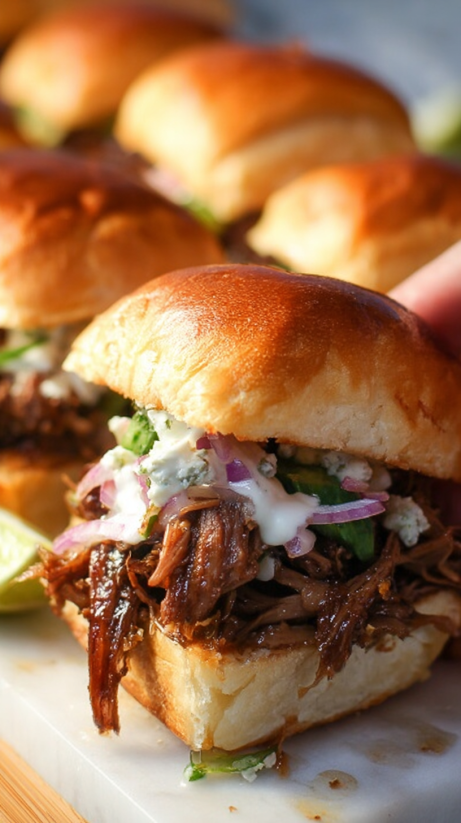 A close up of a beef birria slider.