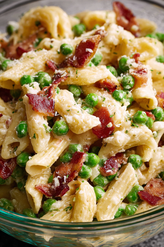 A creamy pasta salad with peas and bacon.