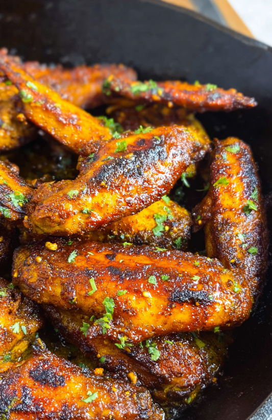A close up of some garlic butter chicken tenders.
