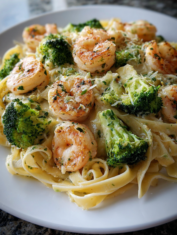 A plate of shrimp and broccoli.