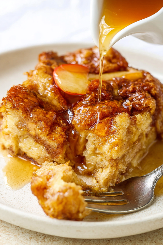 A piece of cake with syrup drizzled on top.
