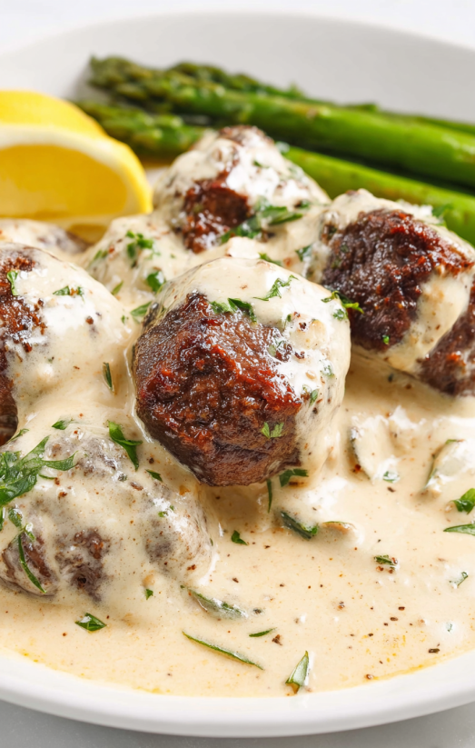 Garlic butter steak bites with parmesan cream sauce.