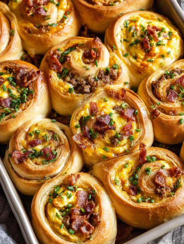 A tray of bacon and cheese rolls.