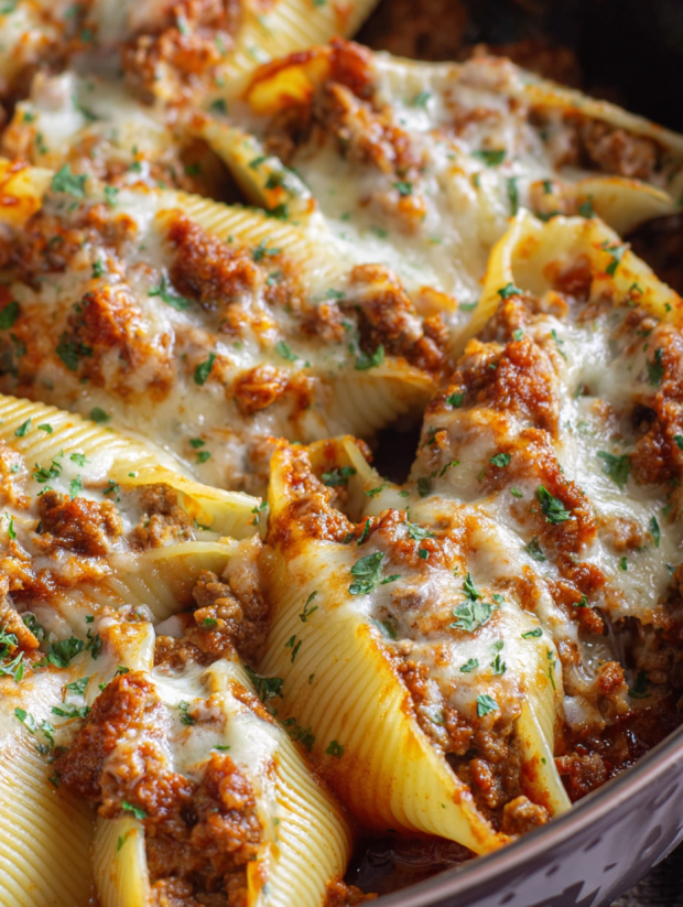 A plate of pasta with meat and cheese.