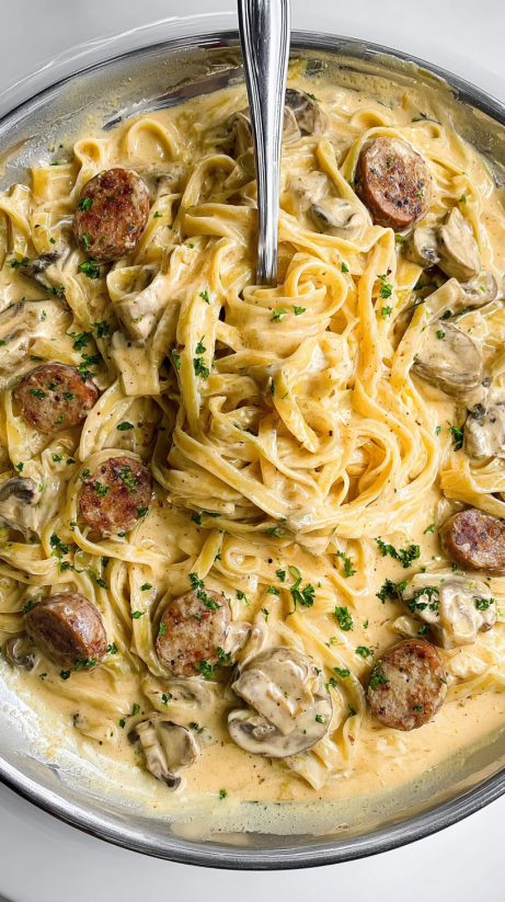 A plate of garlic butter steak with parmesan alfredo.