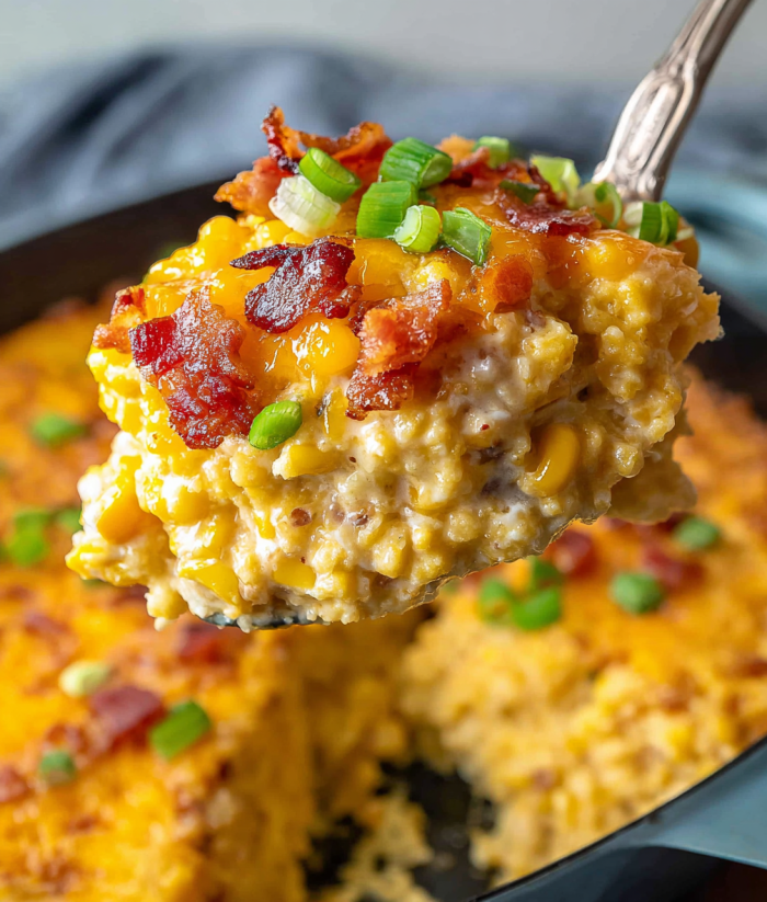 A close up of a piece of cheesy loaded slow cooker creamed corn.