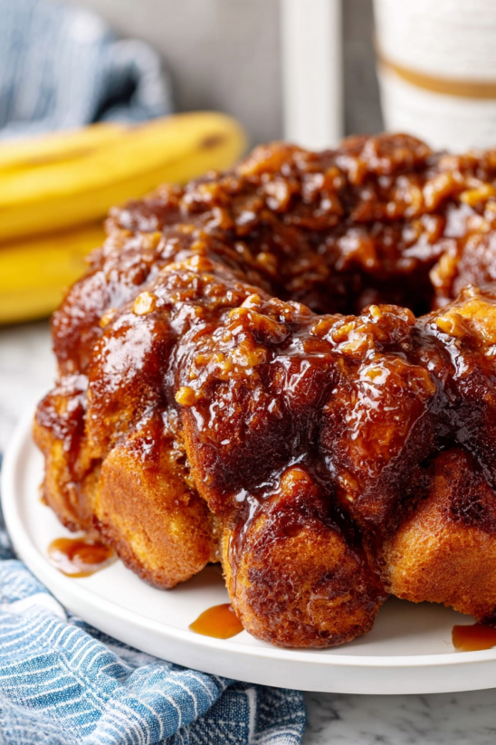 A cake with bananas on top.