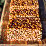 Puffed wheat squares on a wooden table.